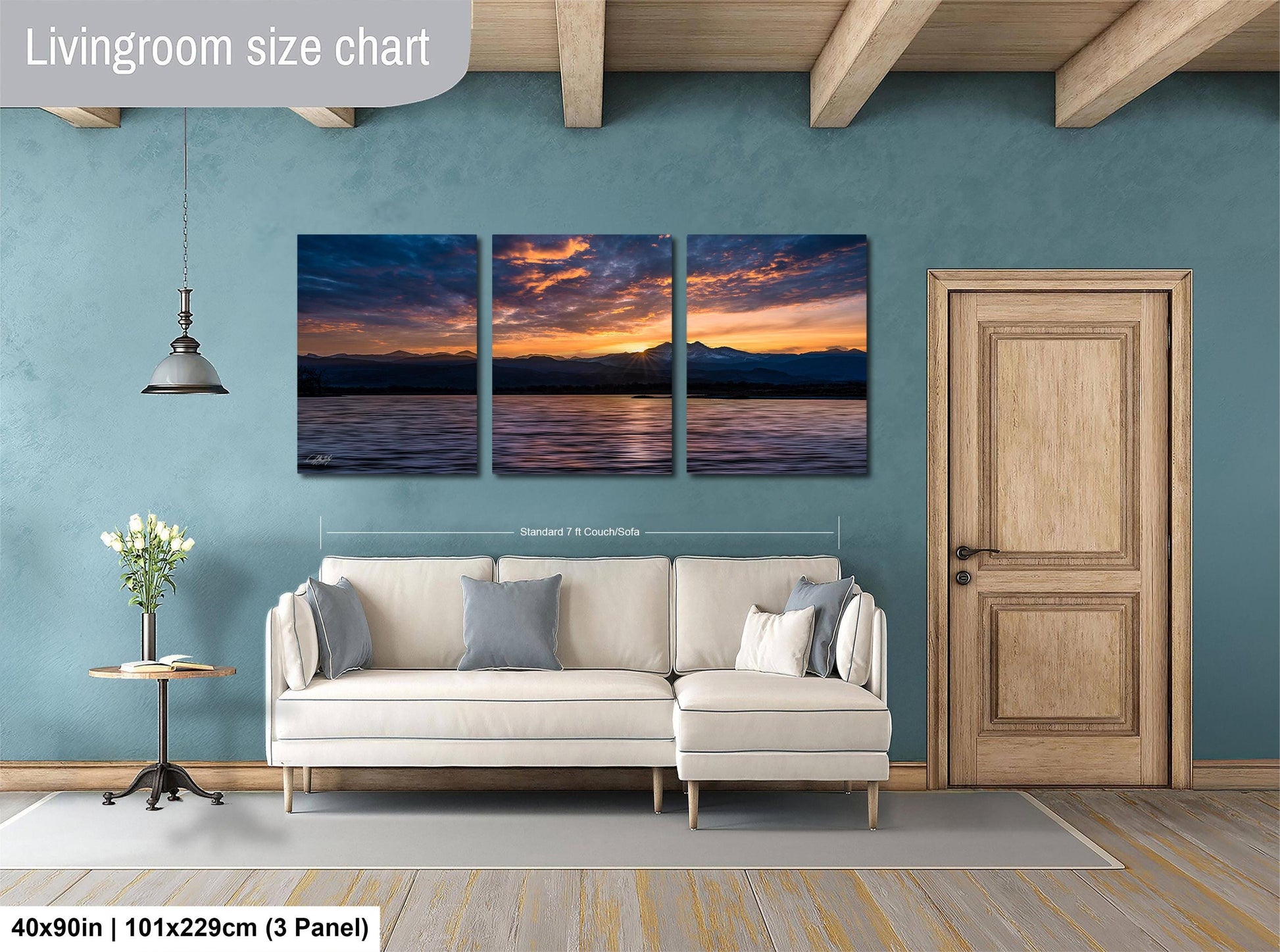 a living room with a couch and a painting on the wall