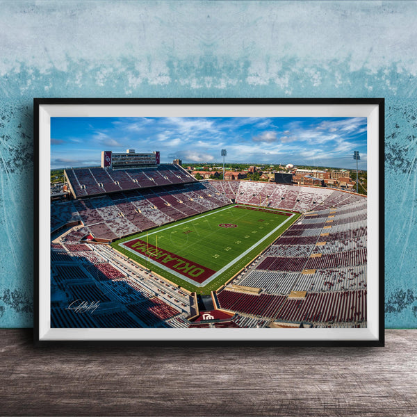 The image is a framed photograph of a football stadium, likely taken from an aerial perspective.