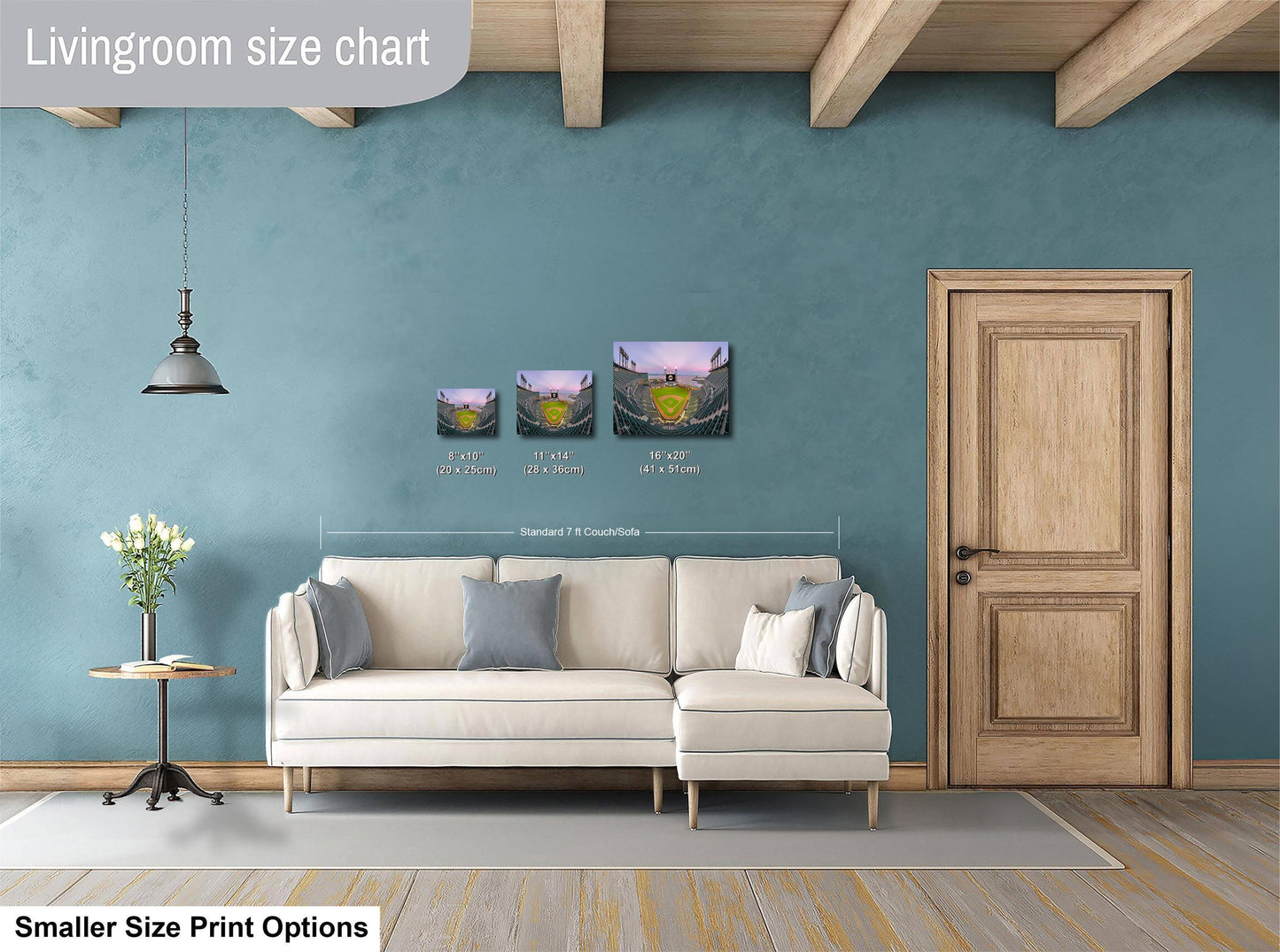 a living room with a white sofa, a wooden door, and a hanging light fixture. There are three framed artworks displayed on the wall, each with different sizes and dimensions. The living room appears to be well-decorated and spacious.