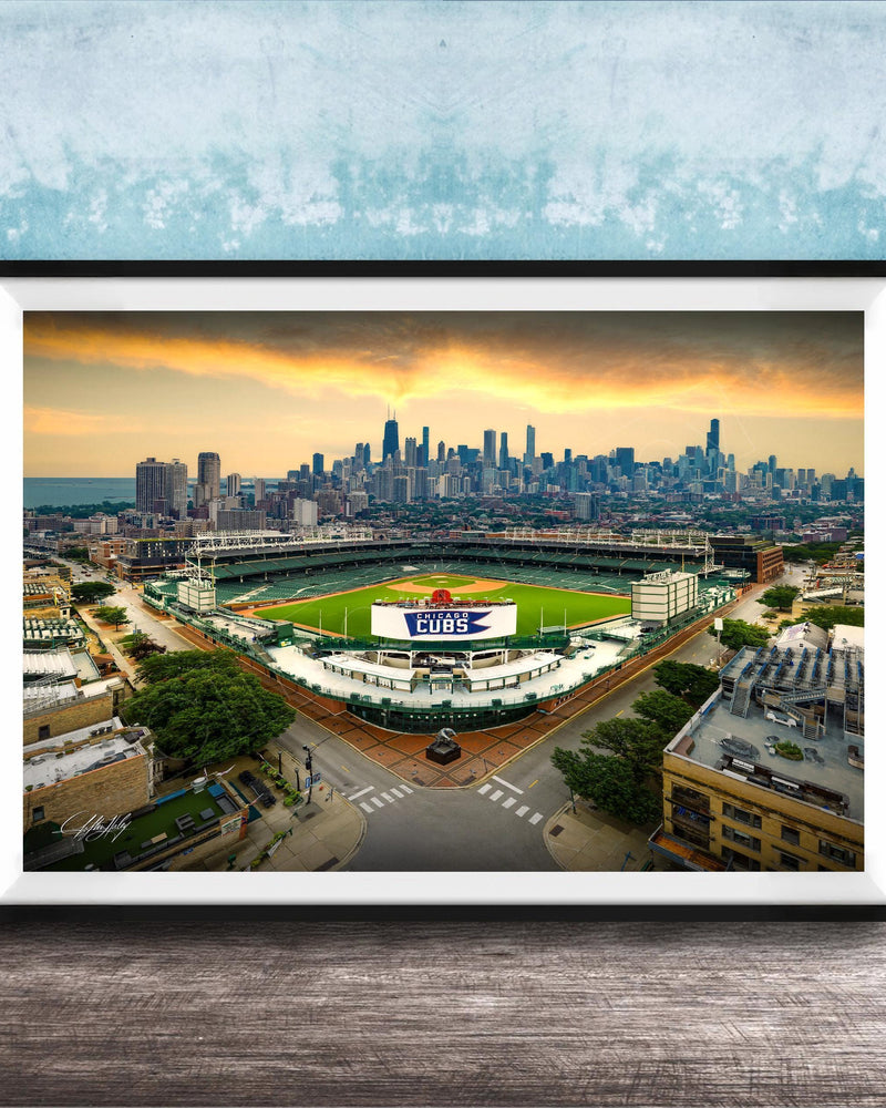 The image is a framed photograph of a baseball stadium in Chicago, Illinois, with the city skyline in the background.