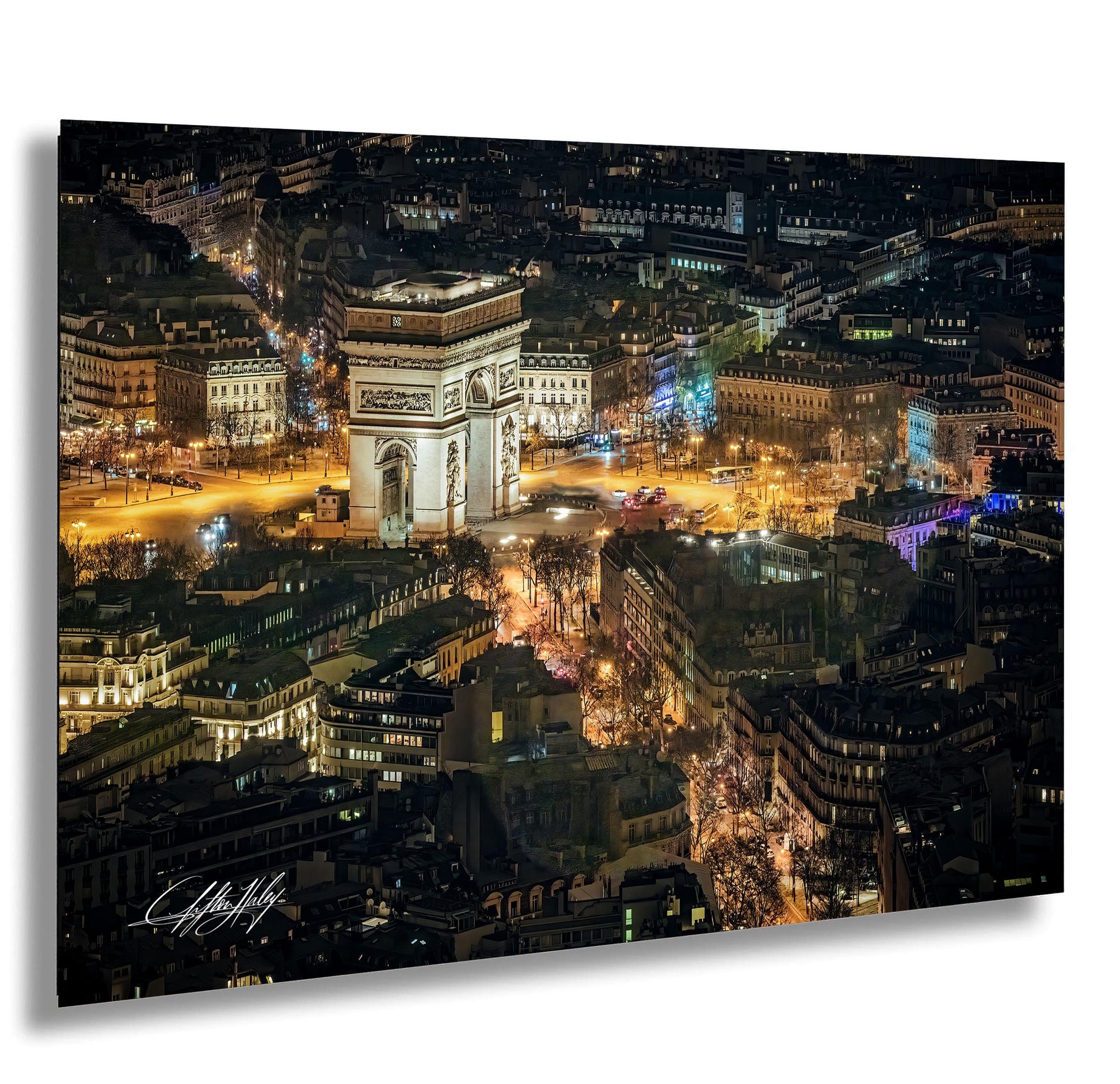 a cityscape at night, featuring a large, illuminated archway surrounded by buildings and illuminated by the city lights.