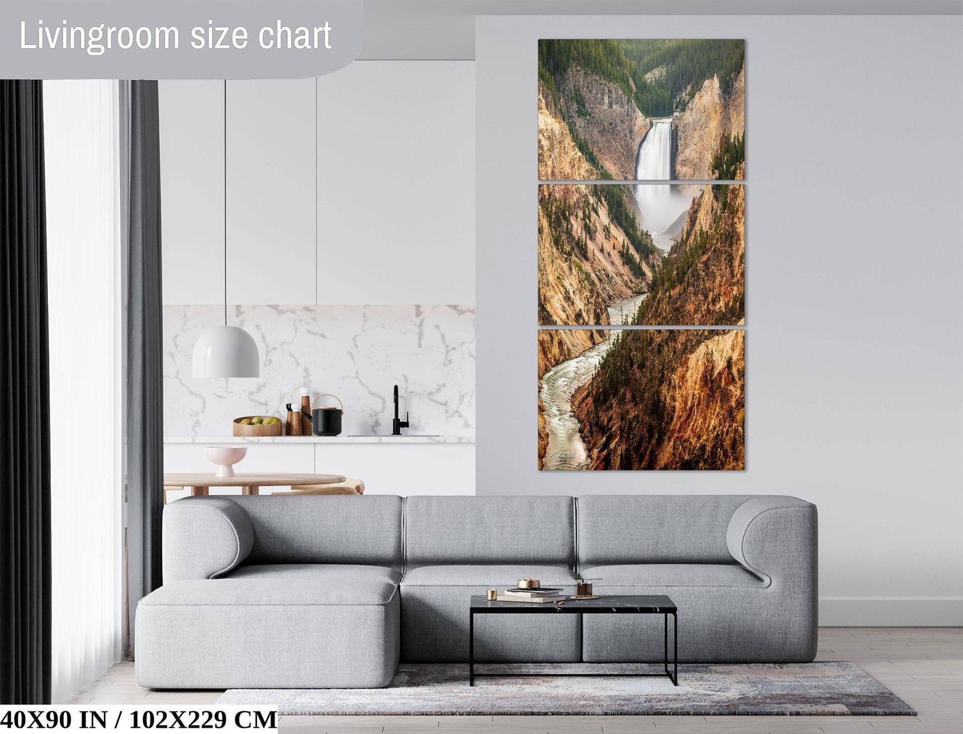 The image is a living room with a gray sofa, a coffee table, and a large wall art depicting a waterfall. The wall art is a three-piece collage, and the living room has a modern design with white walls and a marble countertop.