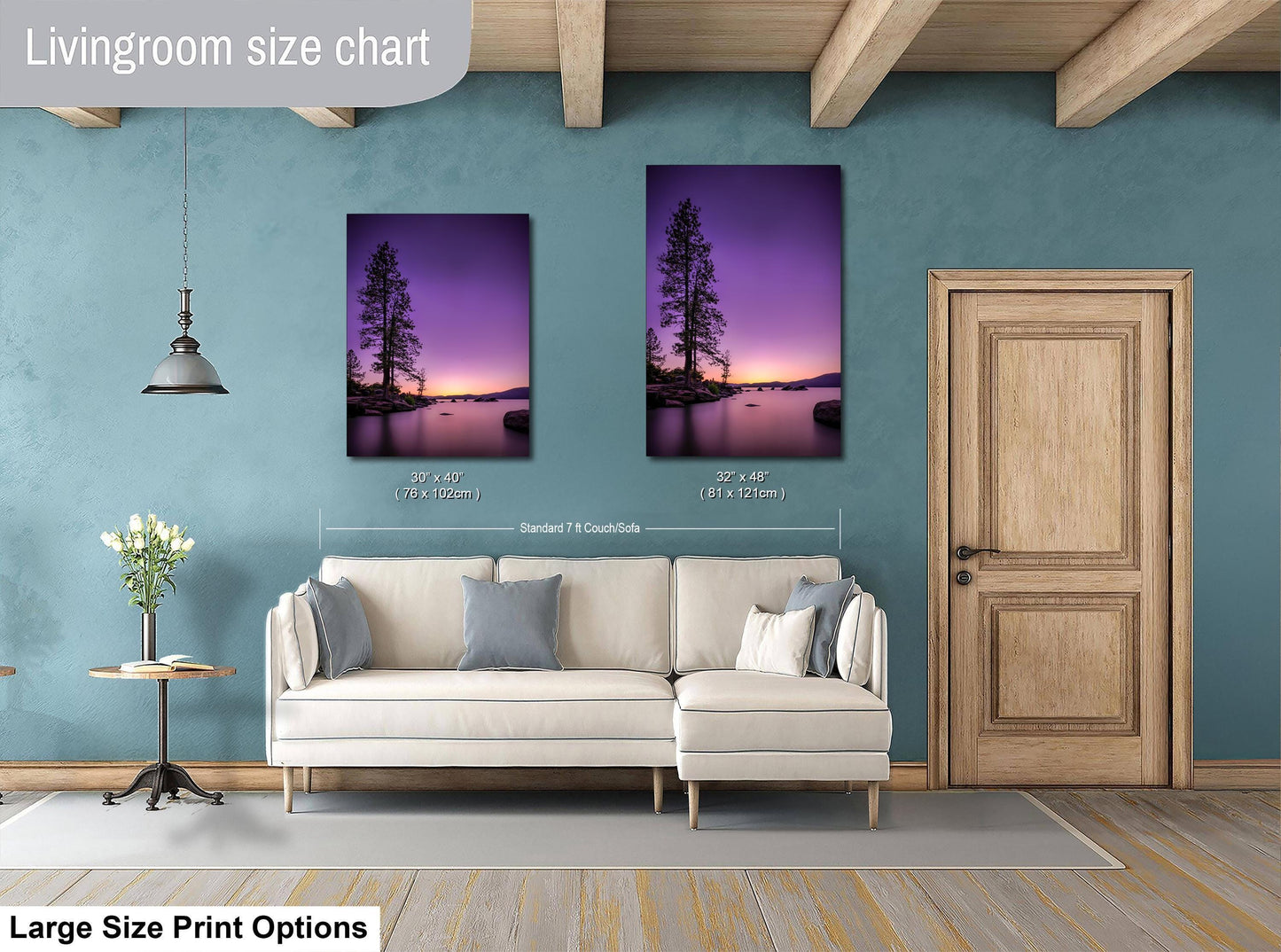 a living room with a white sofa and a wooden door. There are two framed pictures hanging on the wall, depicting a sunset landscape. The living room appears to be well-decorated and cozy.