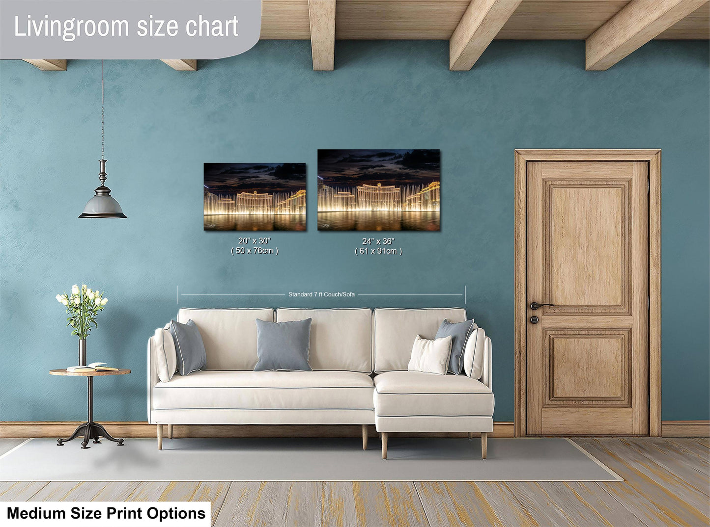 a living room with a white sofa, a wooden door, and a painting hanging on the wall. The painting is of a cityscape at night, featuring a long exposure capturing the lights of the city. The living room appears to be well-lit and spacious, with a wooden floor and a rug on the floor.