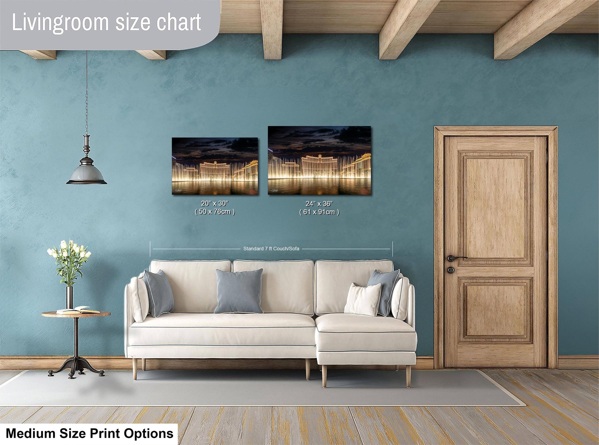 a living room with a white sofa, a wooden door, and a painting hanging on the wall. The painting is of a cityscape at night, featuring a long exposure capturing the lights of the city. The living room appears to be well-lit and spacious, with a wooden floor and a rug on the floor.