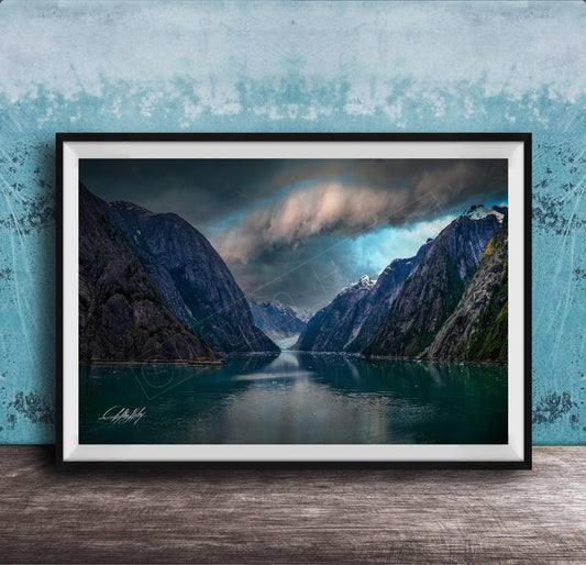 a serene landscape with a calm lake surrounded by towering mountains under a dramatic cloudy sky.