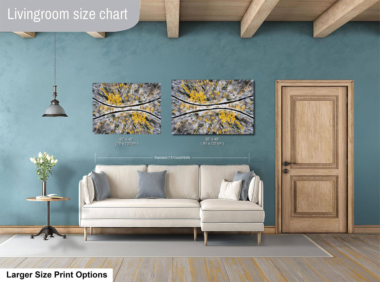 a living room with a white sofa, a wooden door, and two framed abstract paintings hanging on the wall.