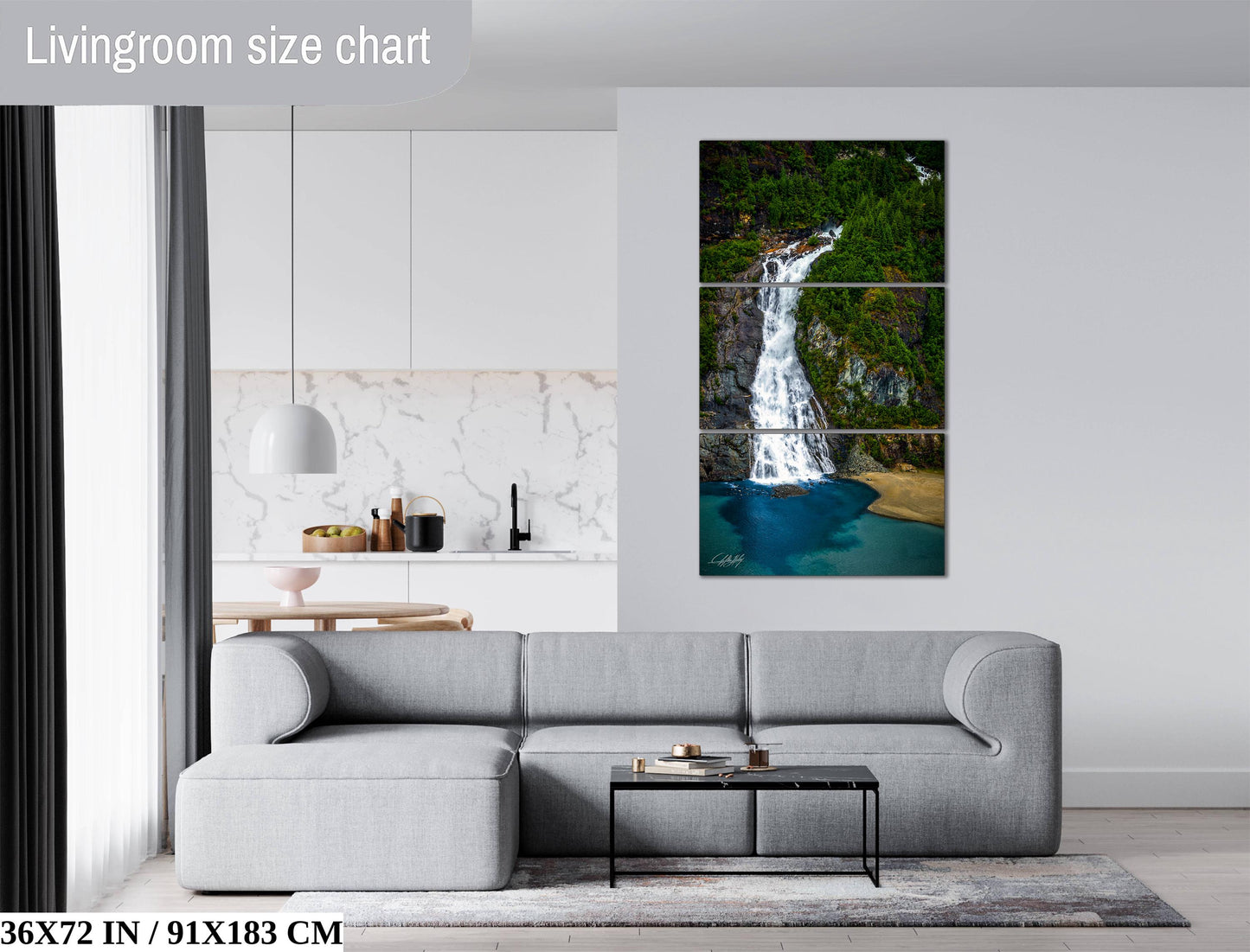 The image is a living room with a gray sofa, a coffee table, and a large painting of a waterfall hanging on the wall.
