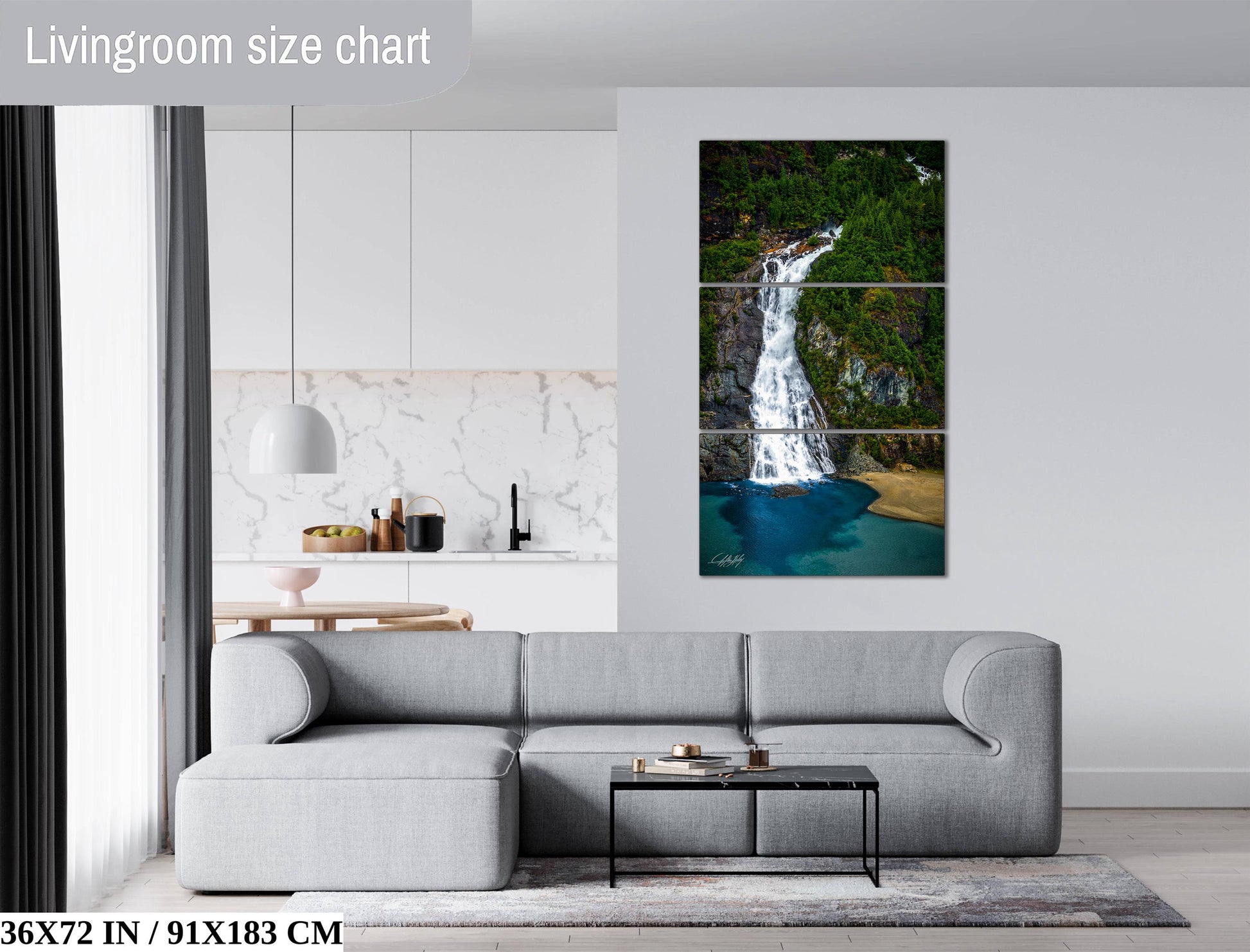 The image is a living room with a gray sofa, a coffee table, and a large painting of a waterfall hanging on the wall.