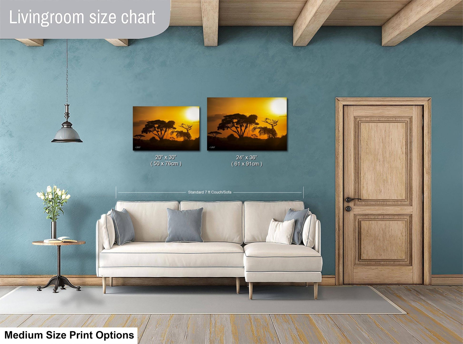 a living room with a white sofa, a wooden door, and a painting of a sunset on the wall. The painting is of a landscape with trees and a sky. The living room appears to be well-decorated and spacious.