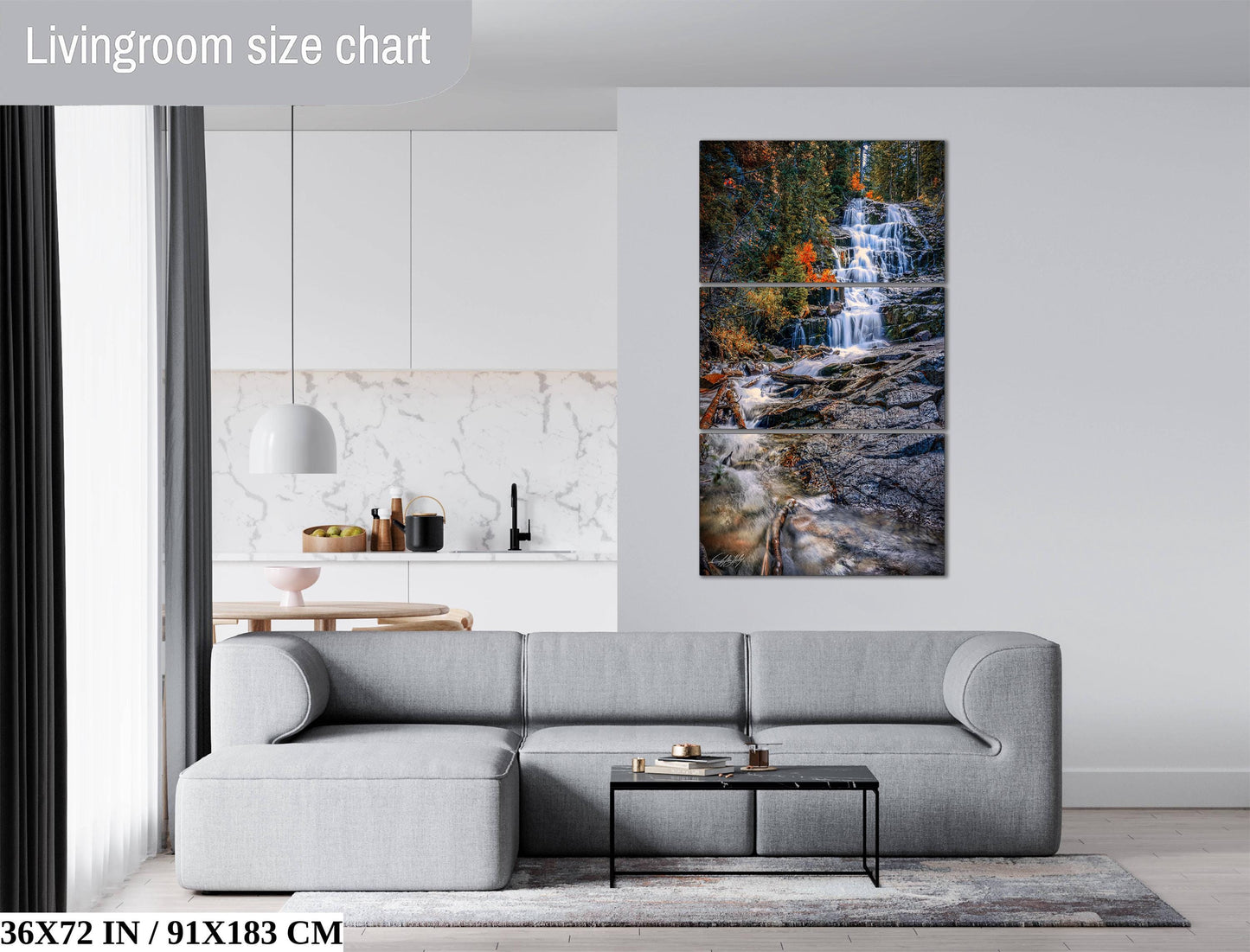 The image is a living room with a gray sofa, a coffee table, and a large painting of a waterfall hanging on the wall.