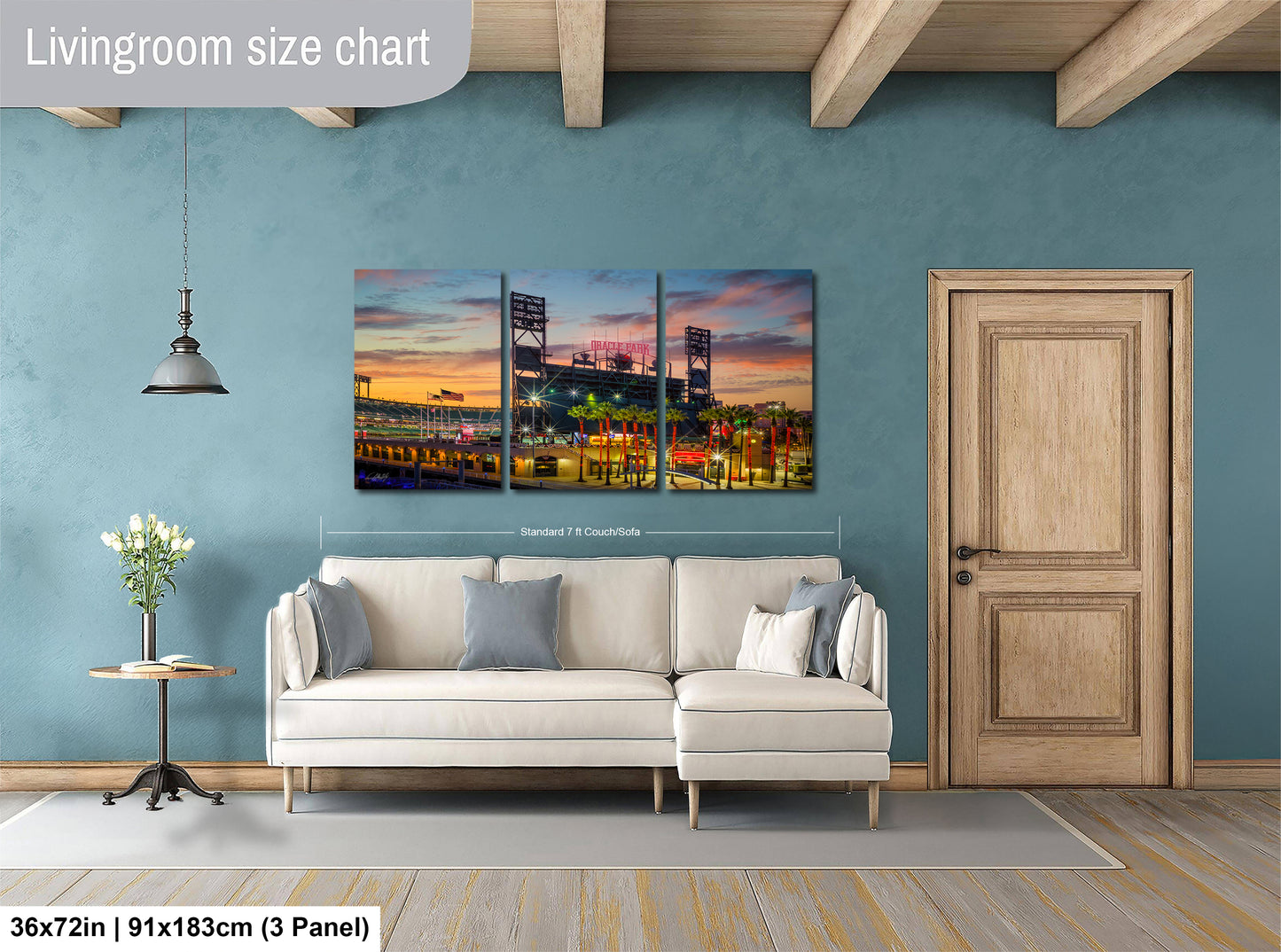 The image is a living room with a large, colorful painting of a city skyline hanging on the wall. The painting is divided into three panels, and the living room has a white sofa and a wooden door.