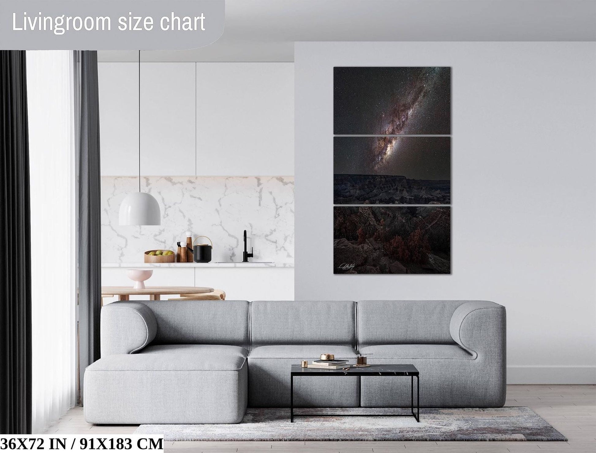 The image is a modern living room with a gray sectional sofa, a coffee table, and a large wall art depicting a galaxy. The room has a minimalist and clean design, with white walls and a marble-like backsplash.