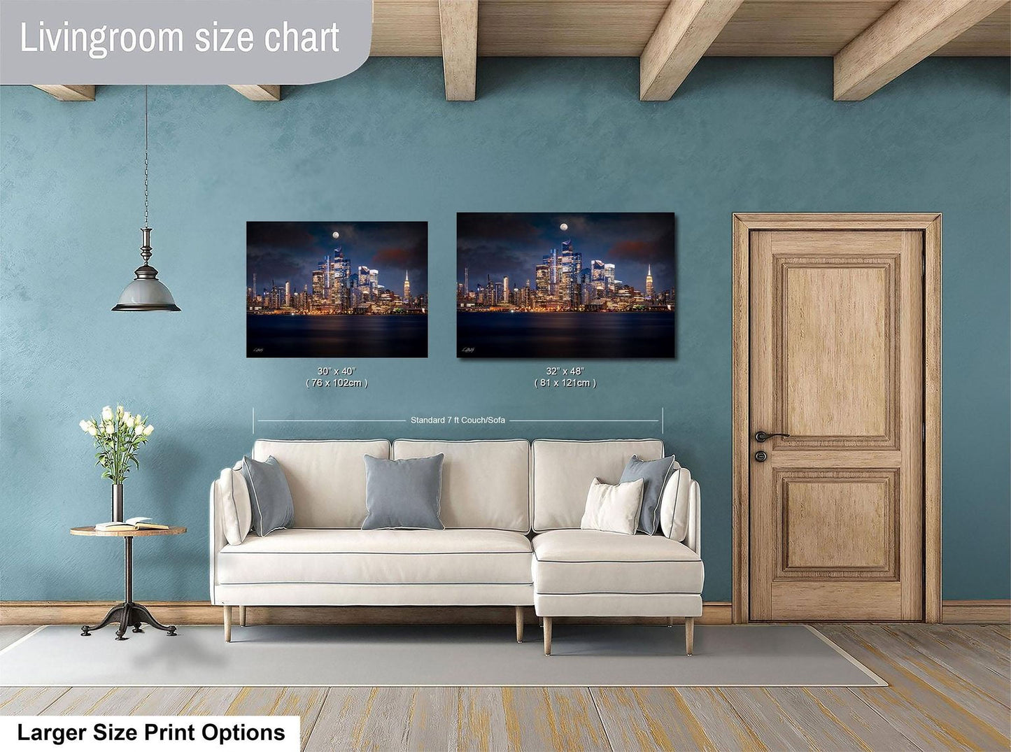 a living room with a white sofa, a wooden door, and two framed cityscape photographs hanging on the wall.