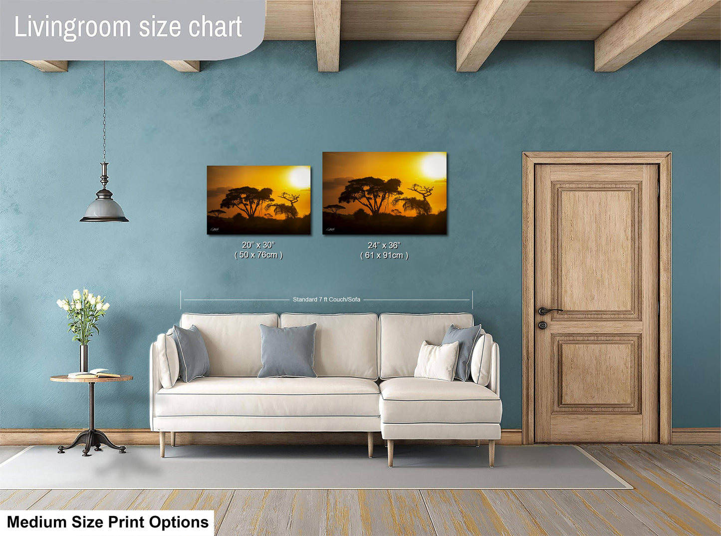 a living room with a white sofa, a wooden door, and a painting of a sunset on the wall. The painting is of a landscape with trees and a sky. The living room appears to be well-decorated and spacious.