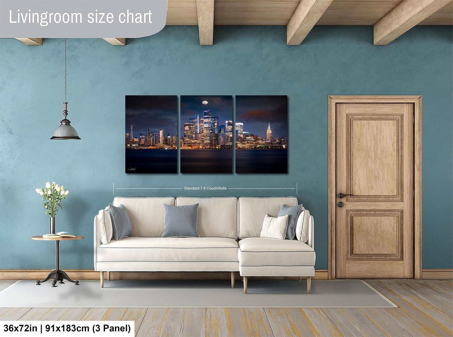 The image is a living room with a large wall art depicting a city skyline at night. The wall art is divided into three panels, with the largest panel covering the entire wall. The room features a white sofa, a wooden door, and a small table with a vase of flowers. The living room size chart indicates that the space is approximately 36 square meters.