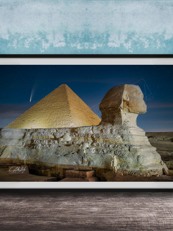 the Great Pyramid of Giza and the Sphinx in Egypt, with the pyramids illuminated against a starry night sky.