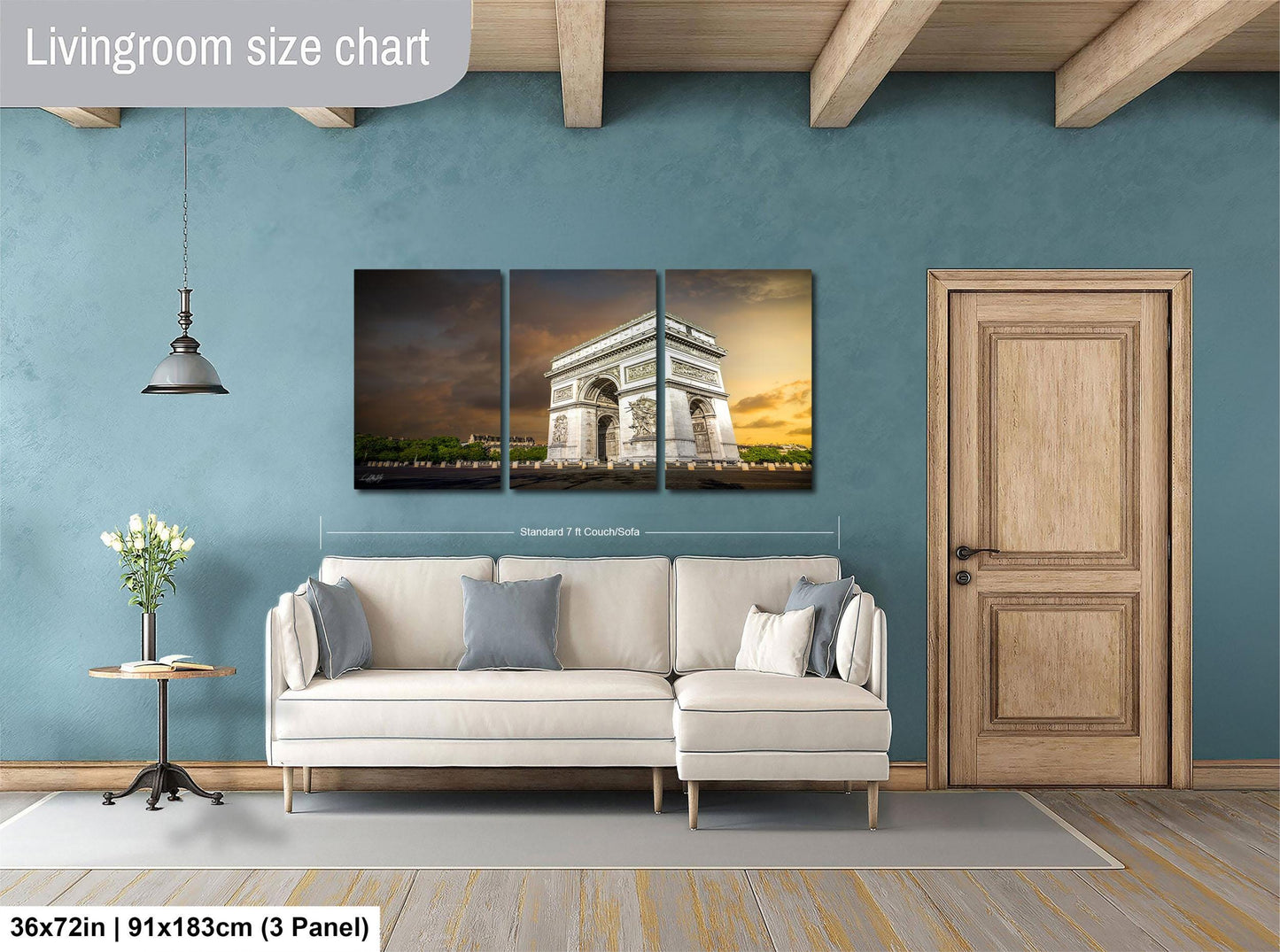 The image is a living room with a large wall art depicting the Arc de Triomphe in Paris. The wall art is divided into three panels, with the largest panel covering the entire wall. The room has a white sofa, a wooden door, and a wooden floor. The living room size chart indicates that the space is approximately 36 square meters.