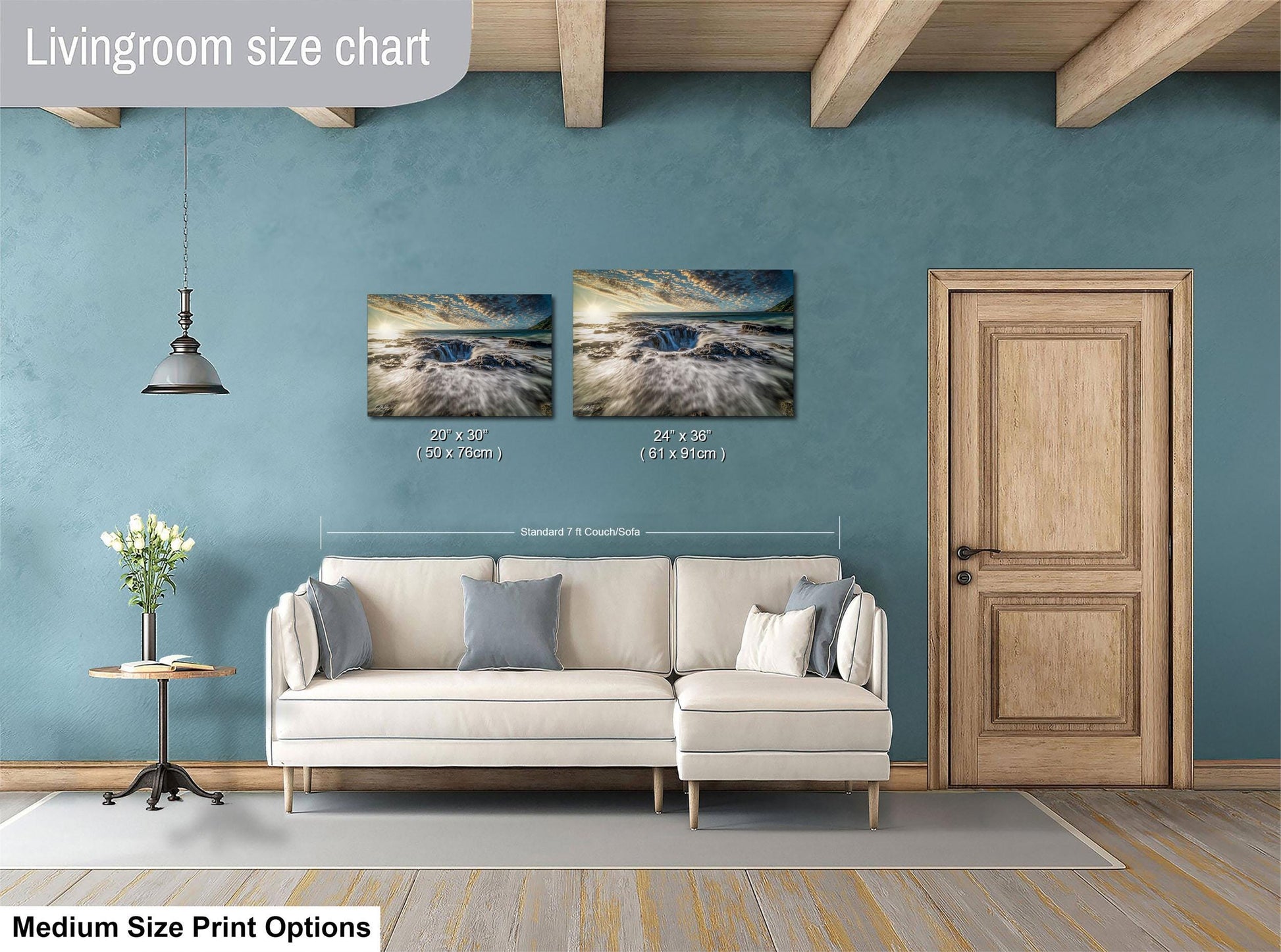 a living room with a white sofa, a wooden door, and a painting hanging on the wall. The painting is of a beach scene with waves crashing on the shore. The living room appears to be designed for relaxation and comfort, with a cozy atmosphere.