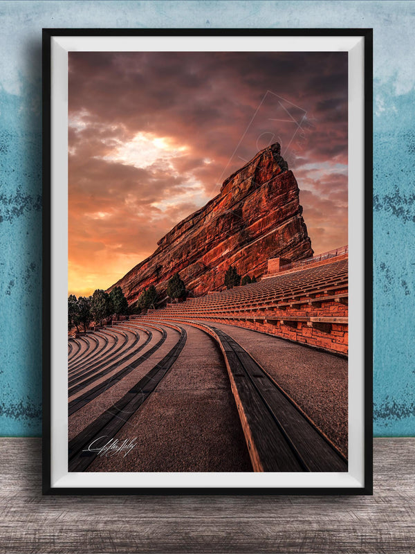 a large, steep rock formation with a dramatic sky in the background, creating a striking and visually appealing scene.