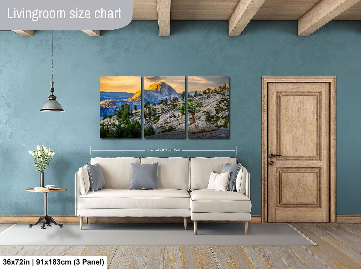 The image is a living room with a large wall art depicting a scenic mountain landscape. The wall art is divided into three panels, with the largest panel covering the entire wall. The room features a white sofa, a wooden door, and a small table with a vase of flowers. The living room size chart indicates that the space is approximately 36 square meters.