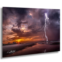 a dramatic lightning storm over a beach at sunset, with the sky filled with vibrant colors and the lightning bolts striking across the scene.