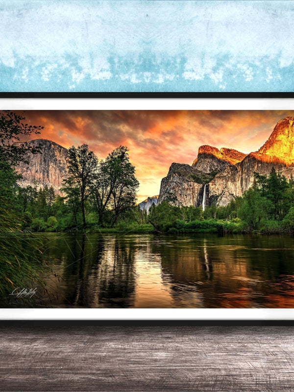 a serene landscape with a calm lake reflecting the vibrant colors of the sky, surrounded by lush greenery and towering mountains.