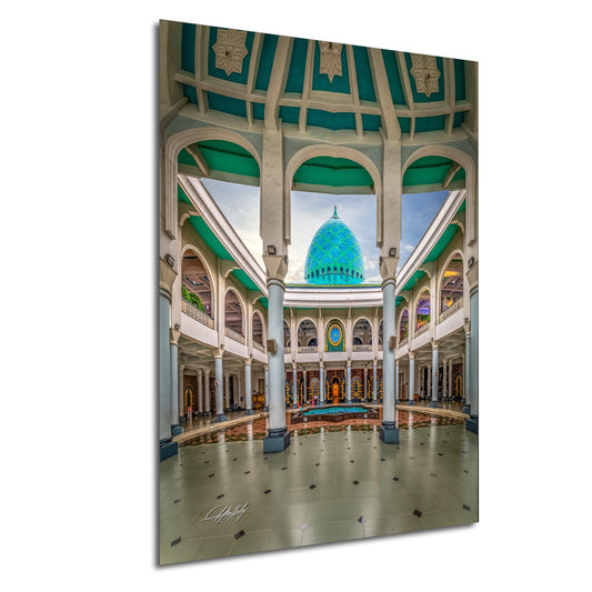 a grand, ornate building with a large, turquoise-colored dome at the center. The building features arched windows, columns, and a tiled floor, creating an impressive architectural structure.
