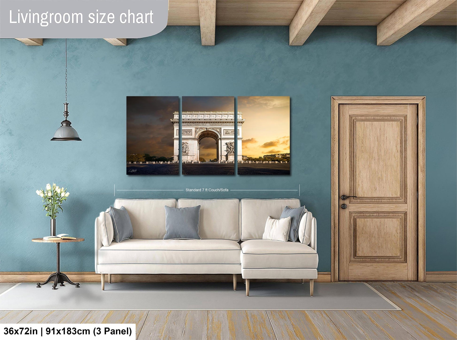 The image is a living room with a large white sofa, a wooden door, and a wall with a large living room size chart. The chart provides dimensions for the living room, including the width and height.