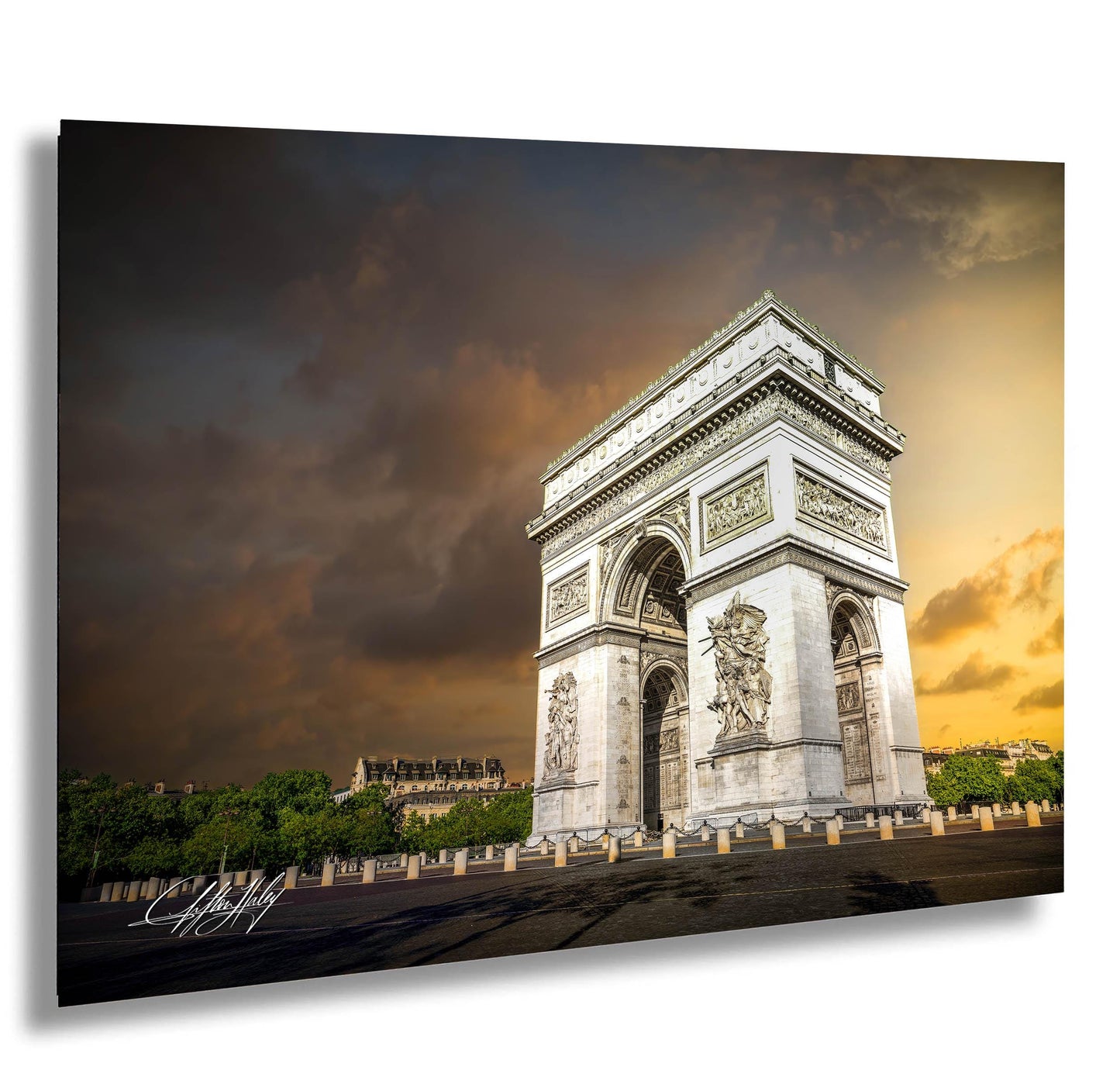 the Arc de Triomphe, a famous monument in Paris, France, with a dramatic sky in the background.