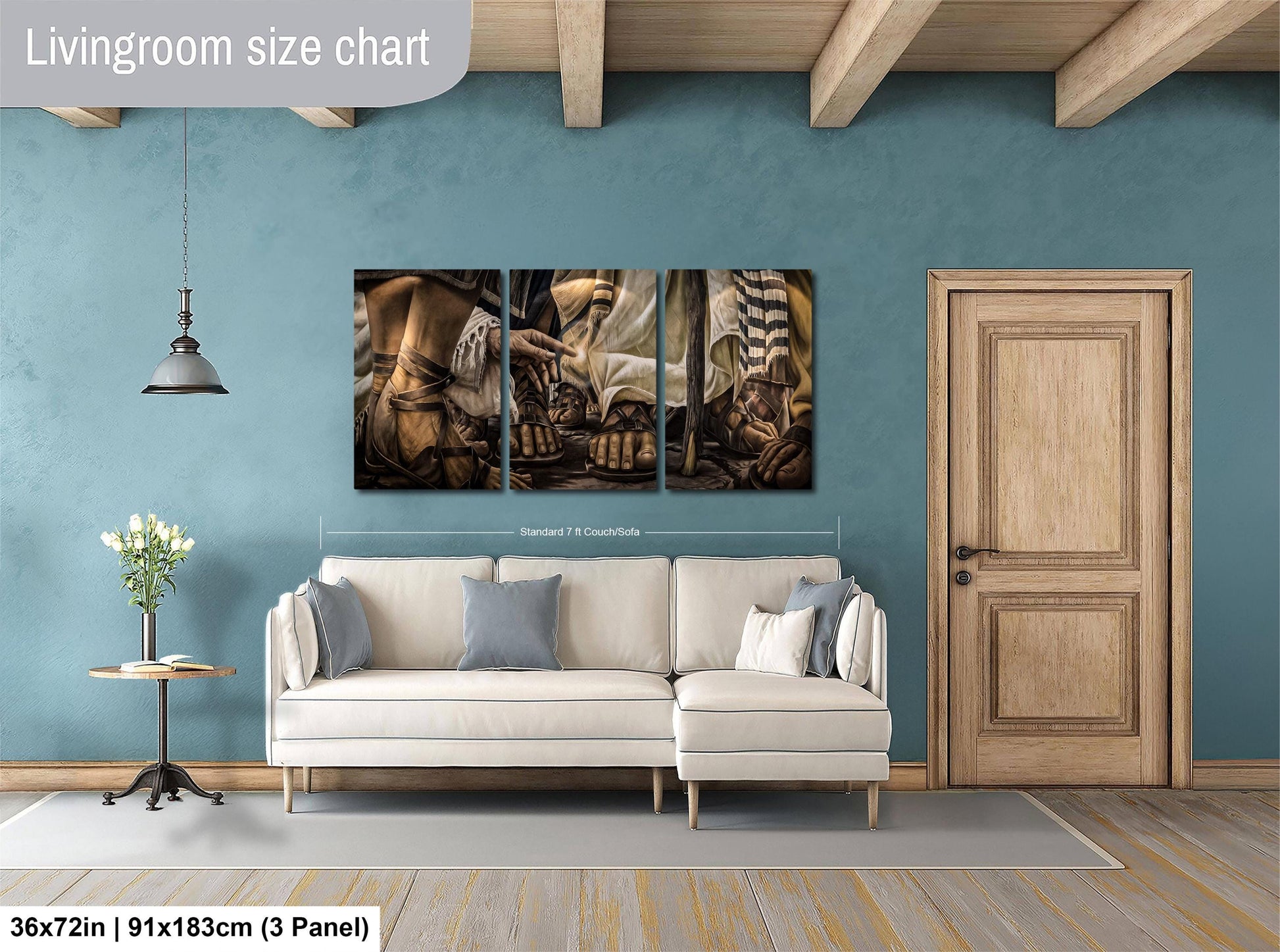 The image is a living room with a large painting of a person's legs hanging on the wall. The painting is divided into three panels, and the room has a white sofa, a wooden door, and a wooden table with a vase of flowers.