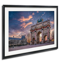 a large, ornate archway with intricate carvings and statues, set against a vibrant sky with colorful clouds.