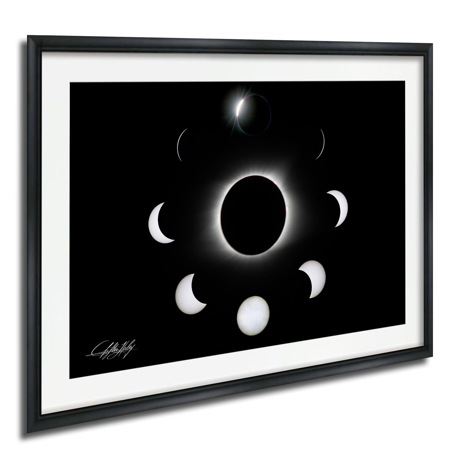 The image is a framed photograph depicting the solar eclipse, showing the moon's phases around the sun.