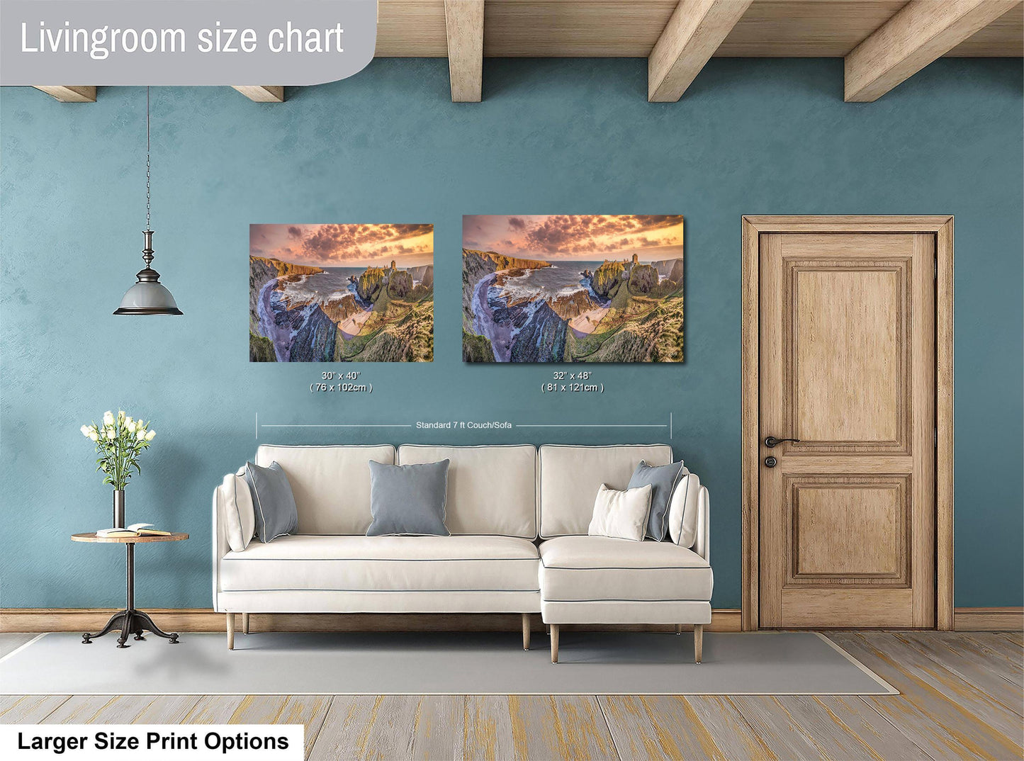 a living room with a couch and two paintings on the wall