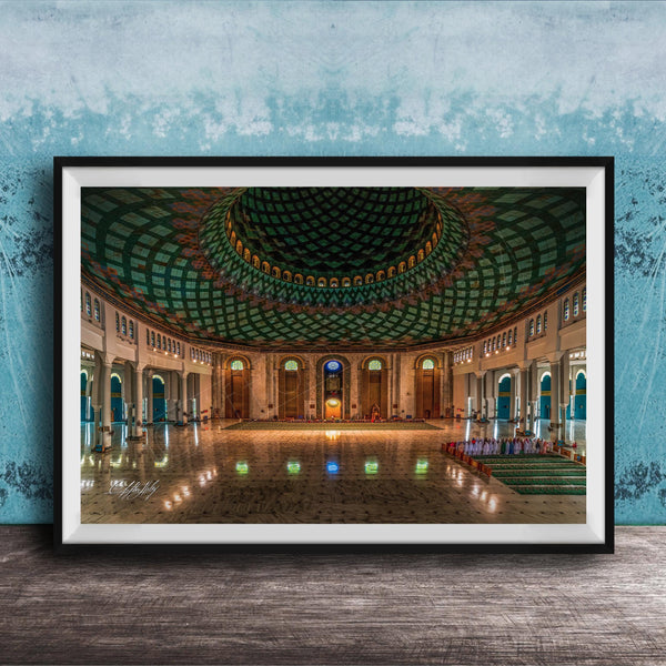 a grand, ornate mosque with a large, domed ceiling and intricate tile work. The interior features a central courtyard surrounded by arched doorways and windows, creating a sense of spaciousness and elegance.