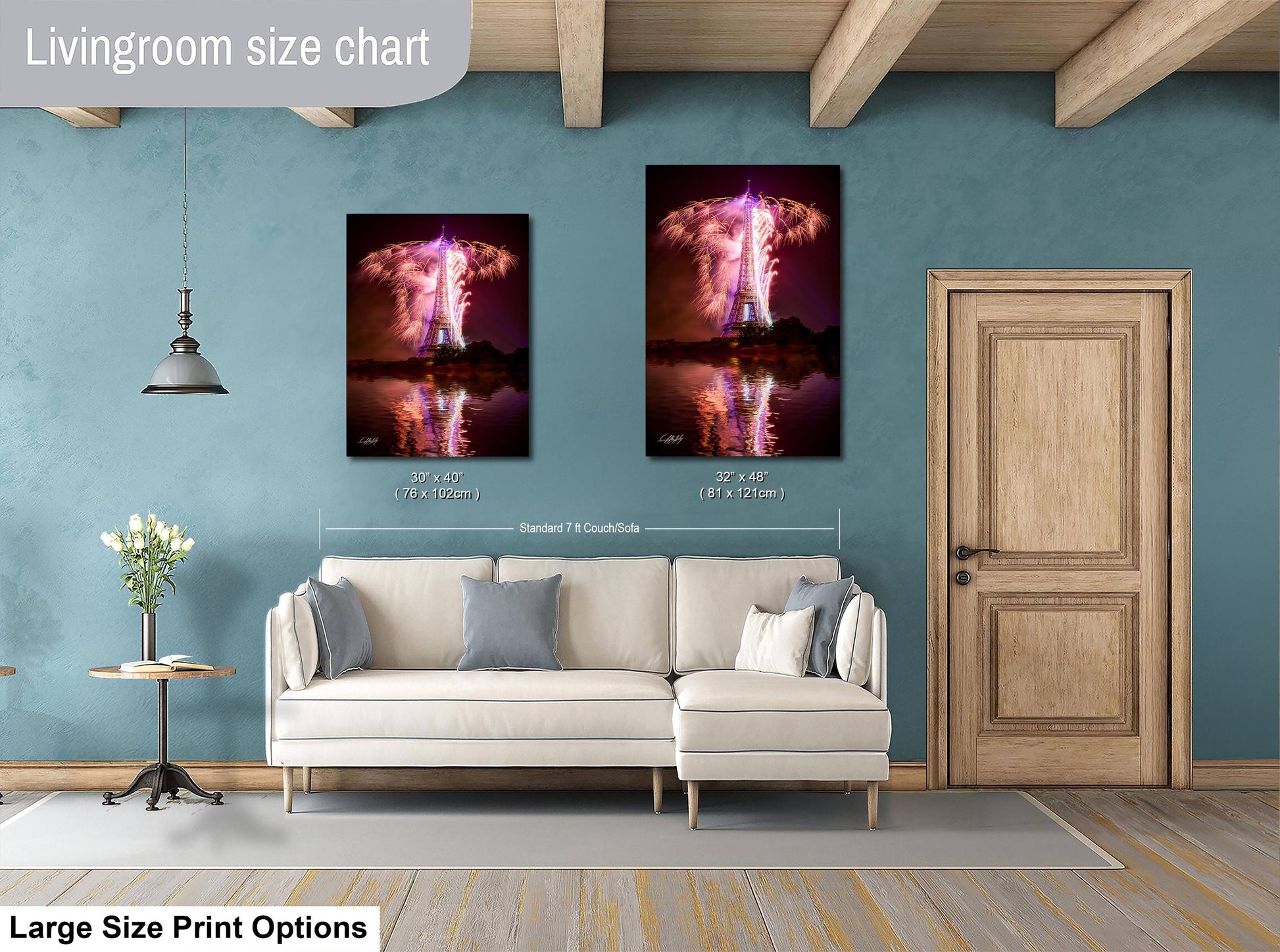 a living room with a white sofa, a wooden door, and a large wall art depicting a rocket launch. The wall art is framed and hangs above the sofa, creating a focal point in the room.