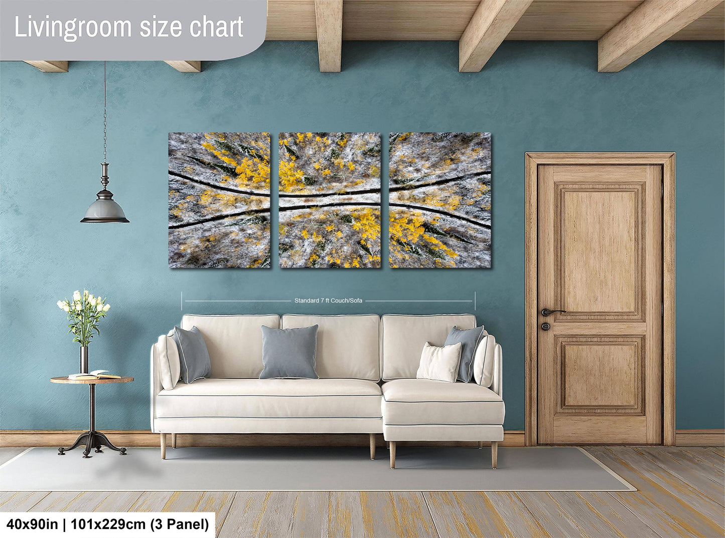 a living room with a white sofa, a wooden door, and a large abstract painting on the wall. The painting is divided into three panels, each depicting a different part of a tree or plant. The sofa is positioned in front of the painting, creating a cozy and inviting atmosphere in the room.