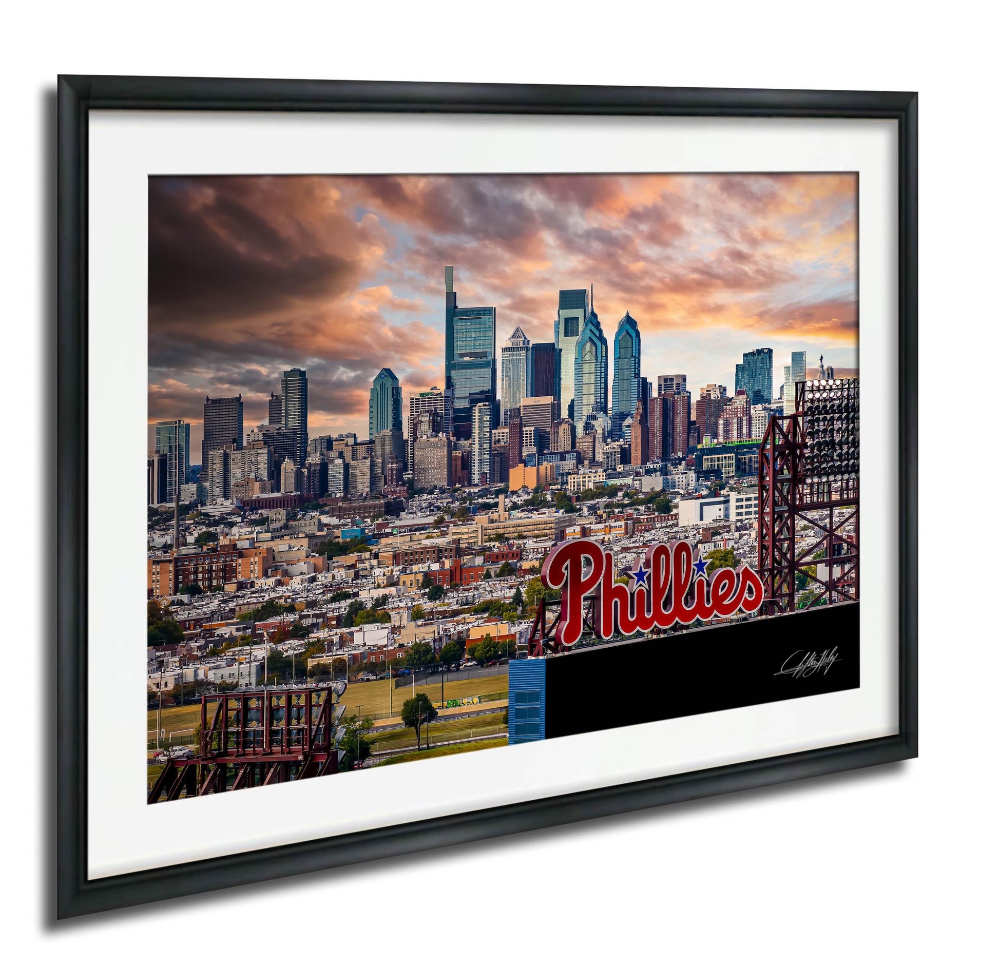 A framed image of the Philadelphia skyline at sunset, with the Phillies stadium prominently displayed in the foreground.