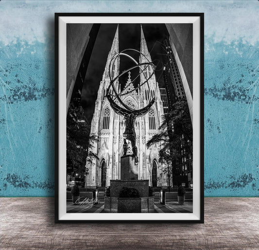 A black and white photograph of a large cathedral with a statue of a man on a pedestal in the foreground, set against a blue wall.