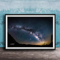 The image is a framed photograph of a night sky with a view of the Milky Way galaxy.
