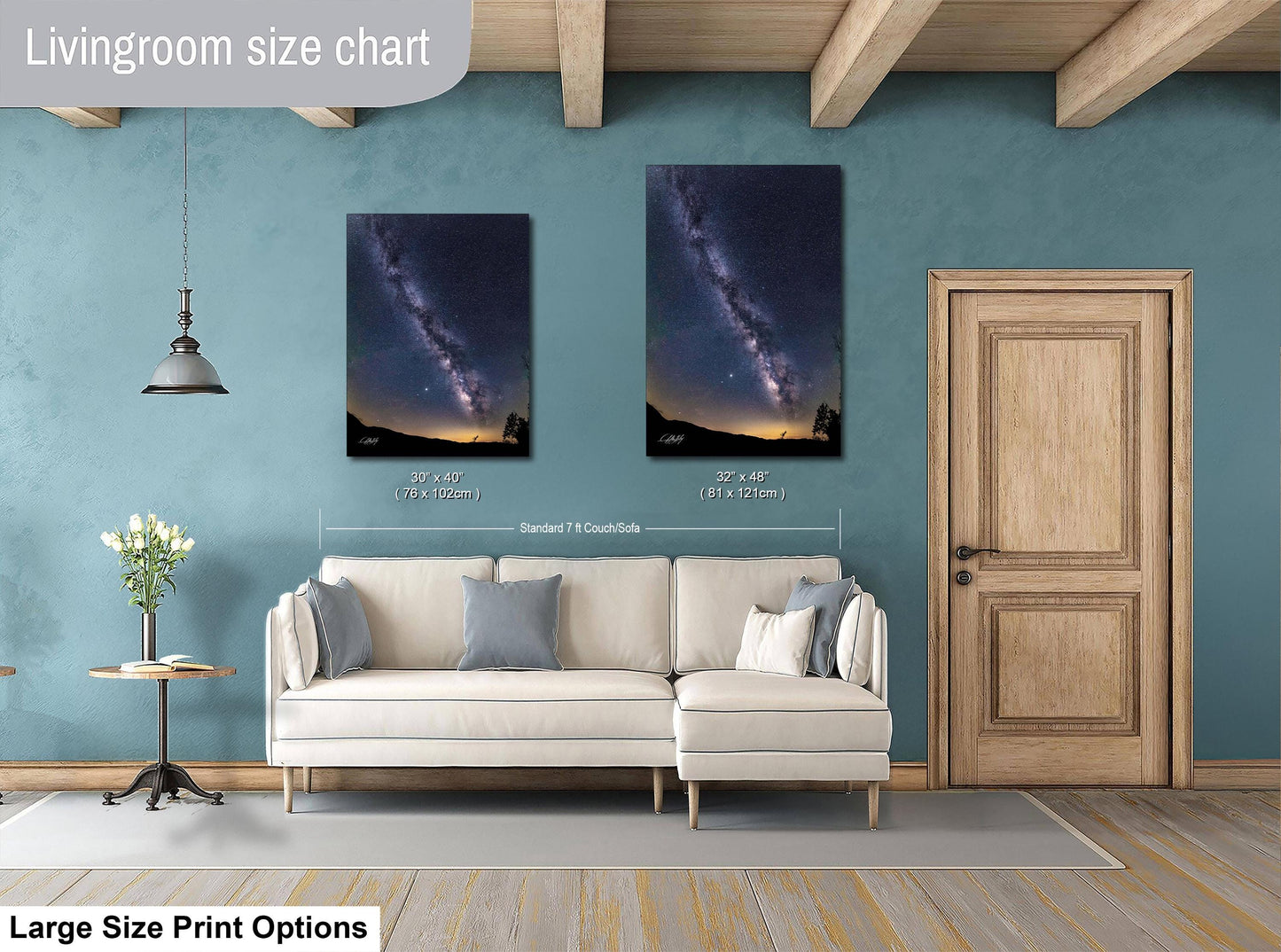 a living room with a white sofa, a wooden door, and a painting of a galaxy on the wall.