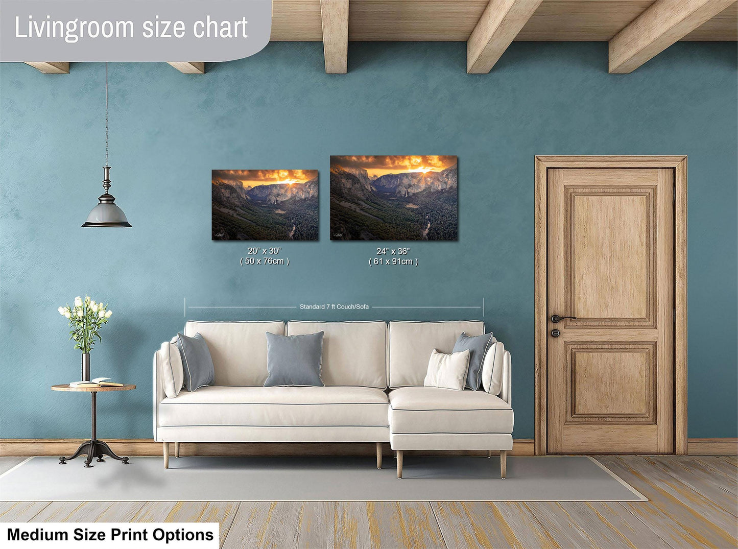 a living room with a white sofa, a wooden door, and a painting of a mountain landscape on the wall.