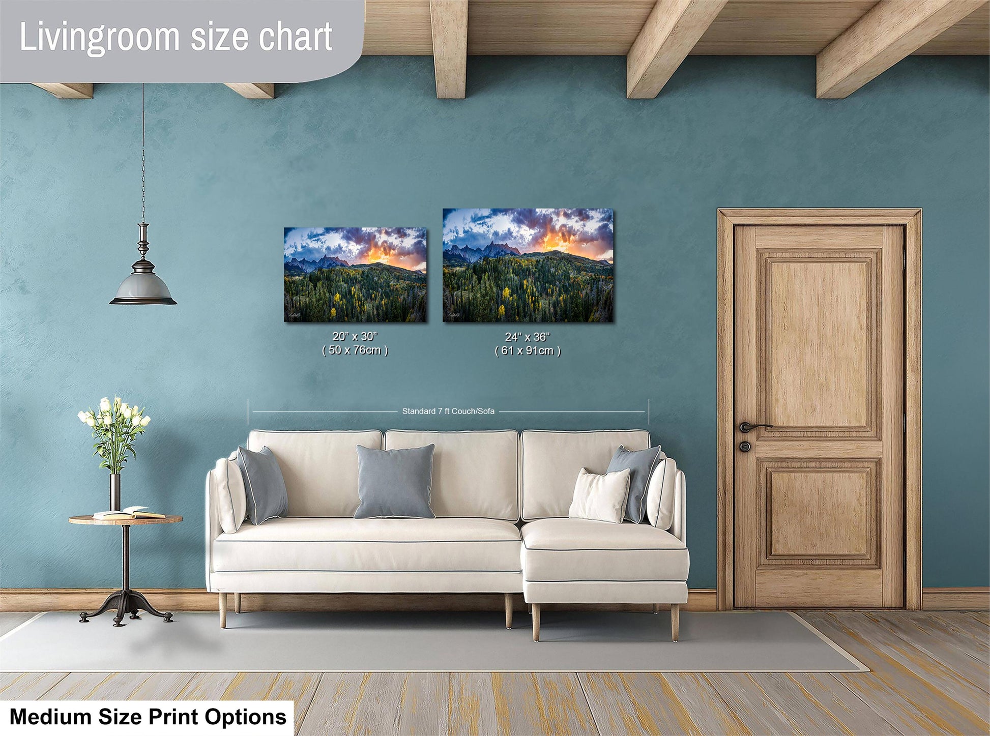 a living room with a white sofa, a wooden door, and a painting of a mountain landscape on the wall. The living room appears to be well-lit and decorated with a modern style.