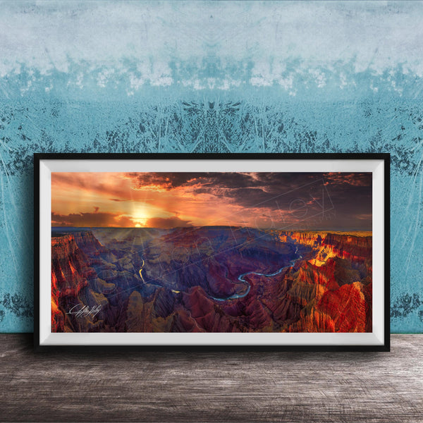 The image is a framed photograph of the Grand Canyon, showcasing the stunning landscape with vibrant colors and dramatic clouds at sunset.
