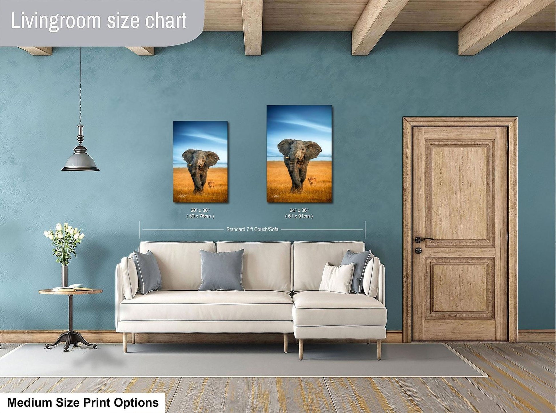 a living room with a white sofa, a wooden door, and a painting of an elephant on the wall. The painting is of a standard size of 24x36 inches.