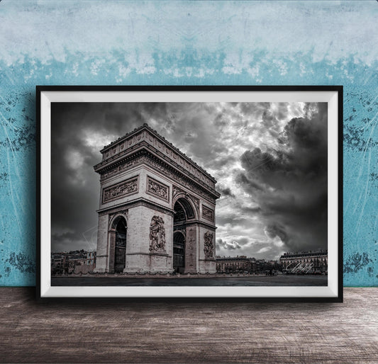 The image is a framed photograph of the Arc de Triomphe in Paris, France, with a dramatic sky in the background.