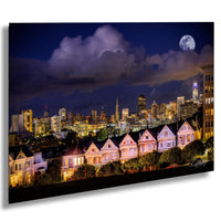 A nighttime cityscape with a full moon and a row of Victorian-style houses in the foreground, with the city's skyscrapers and buildings illuminated in the background.