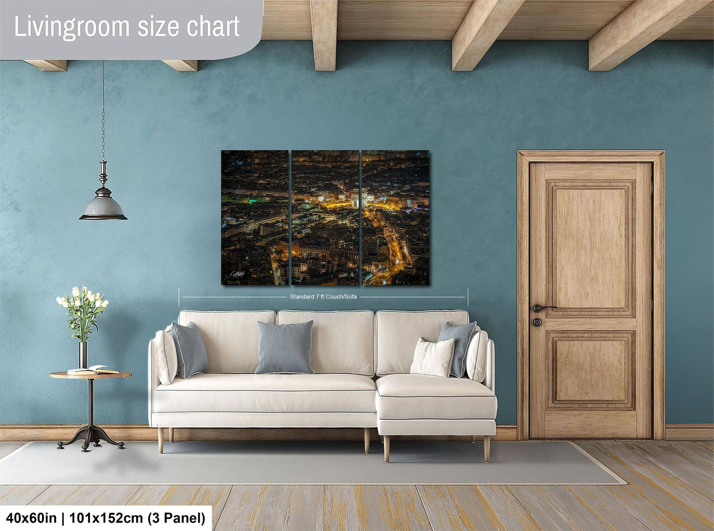 The image is a living room with a large, three-panel, high-resolution cityscape painting hanging on the wall. The painting depicts a nighttime city scene with illuminated buildings and streets. The room is furnished with a white sofa and a wooden door, and there is a potted plant and a vase on a side table. The living room size chart indicates that the space is approximately 40'x60', with a total height of 101'x152', and a width of 3' panel.