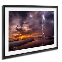 a dramatic lightning storm over a beach, with the sky filled with vibrant colors and streaks of lightning illuminating the scene.