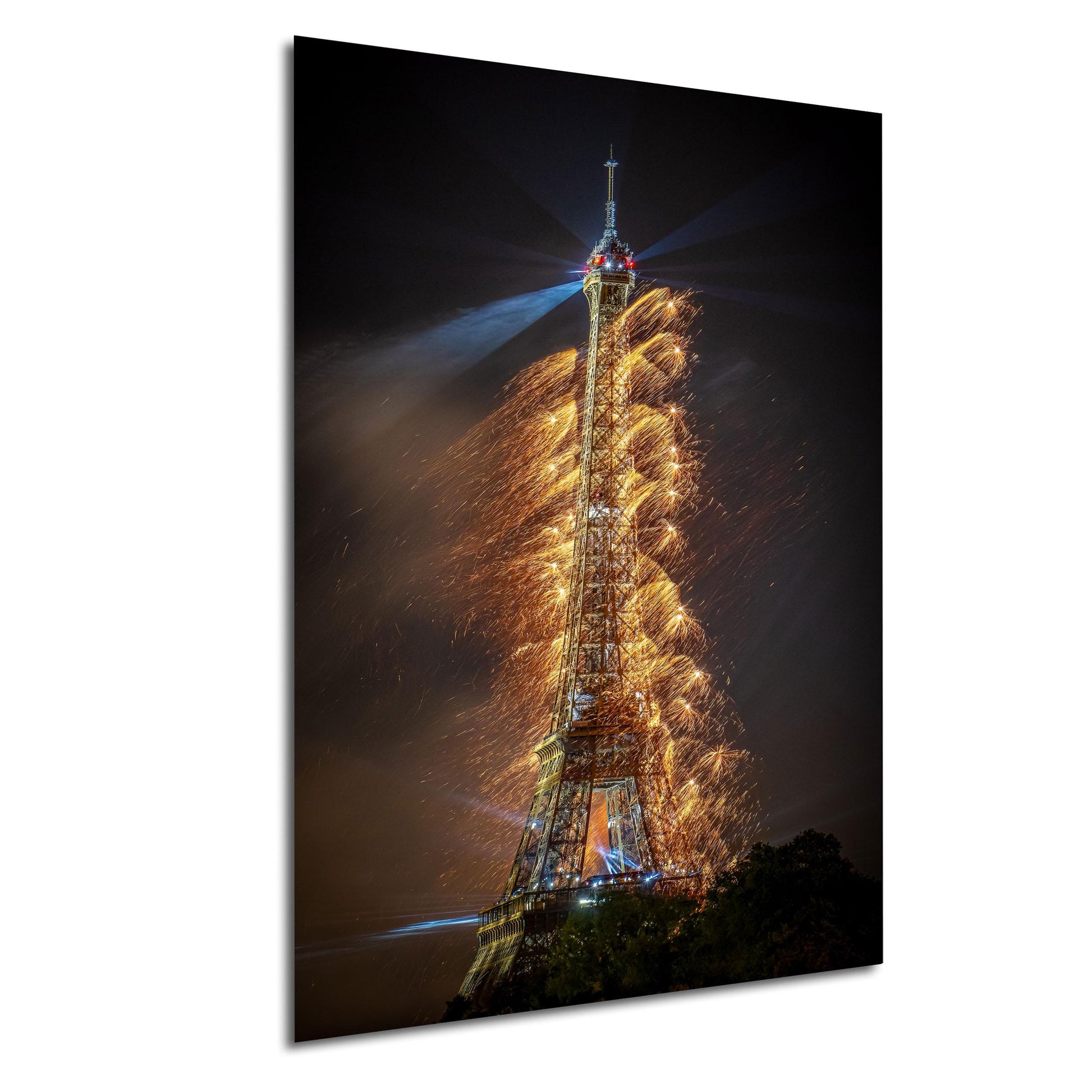 a tall, illuminated tower with a bright light at the top, surrounded by a shower of sparks or firework-like effects, creating a visually striking and dynamic scene.